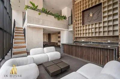 a living room with white furniture in a house at Morph 601 - Elegance & tranquility with AC/BBQ in El Poblado