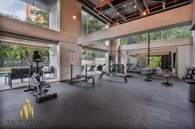 a gym with treadmills and machines in a building at Morph 601 - Elegance & tranquility with AC/BBQ in El Poblado