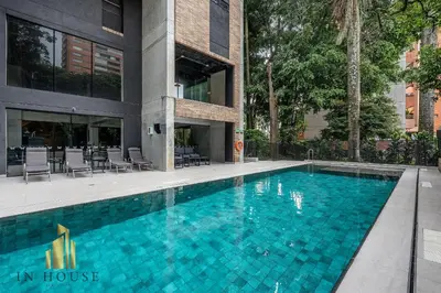 a swimming pool in front of a building at Morph 701 - Spacious apt City View Haven in El Poblado