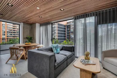 a living room with a couch and a table at Morph 701 - Spacious apt City View Haven in El Poblado