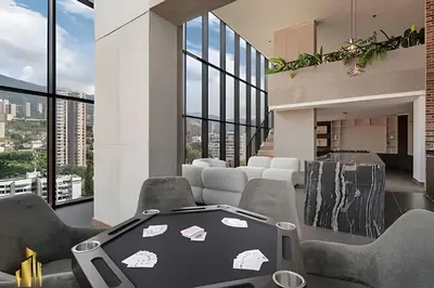 a dining room with a table and chairs and windows at Morph 702 - Luxy Apartment with Panoramic View, AC in El Poblado