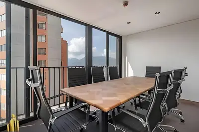 a dining room with a table and chairs on a balcony at Morph 702 - Luxy Apartment with Panoramic View, AC in El Poblado