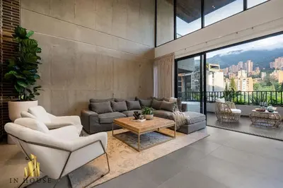 a living room with a couch and a table at Morph 902 - Luxury Apt in Poblado with Balcony in El Poblado