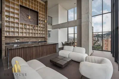 a living room with white furniture and a fireplace at Morph 902 - Luxury Apt in Poblado with Balcony in El Poblado