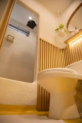a bathroom with a toilet and a shower at Poblado-Manila encantador apartamento in Medellín