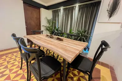 a conference room with a wooden table and chairs at Poblado-Manila encantador apartamento in Medellín