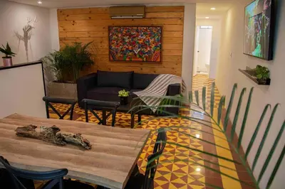 a living room with a table and a couch at Poblado-Manila encantador apartamento in Medellín