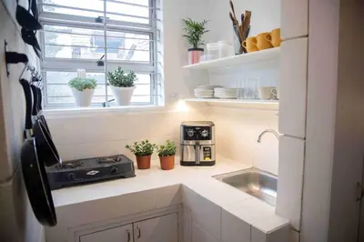 a kitchen with a coffee maker and a sink at Poblado-Manila encantador apartamento in Medellín