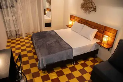 a bedroom with a bed and a checkered floor at Poblado-Manila encantador apartamento in Medellín
