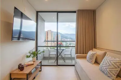 a living room with a couch and a table at Beautiful apartment in Poblado in Medellín