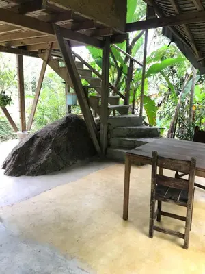 a wooden table and a chair in a room at Refugio Cumaná in San Rafael
