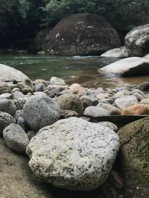 a group of rocks on the side of a river at Refugio Cumaná in San Rafael