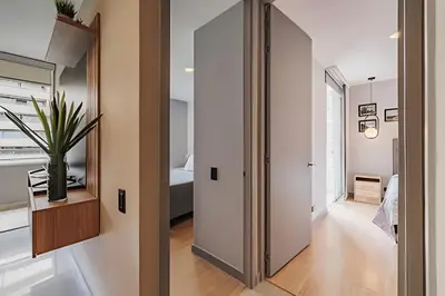 a hallway with a door leading to a bedroom at Next Avenue 702 - Apt with balcony and AC/Poblado in El Poblado