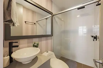 a bathroom with a sink and a glass shower at Next Avenue 702 - Apt with balcony and AC/Poblado in El Poblado