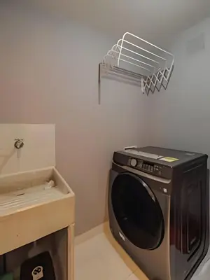 a kitchen with a microwave and a dryer in a room at Next Avenue 702 - Apt with balcony and AC/Poblado in El Poblado