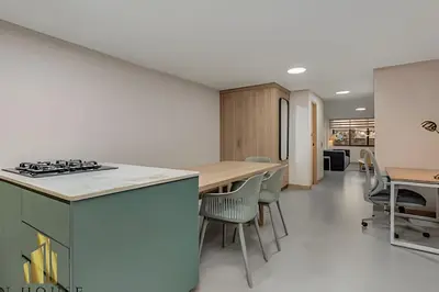 an open kitchen and dining room with a table and chairs at Paola 201 - Charm and perfect location in Laureles in Guayaquil