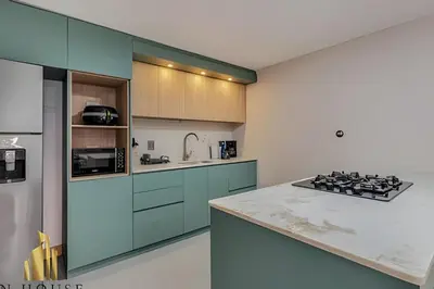 a kitchen with blue cabinets and a counter top at Paola 201 - Charm and perfect location in Laureles in Guayaquil