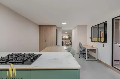 a kitchen with a stove and a counter top at Paola 201 - Charm and perfect location in Laureles in Guayaquil