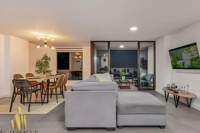 a living room with a couch and a table at Poblado Del Campestre 203 - Comfort & Exclusivity in Envigado