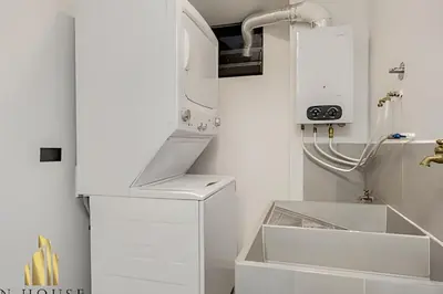 a white kitchen with a sink and a microwave at Poblado Del Campestre 203 - Comfort & Exclusivity in Envigado