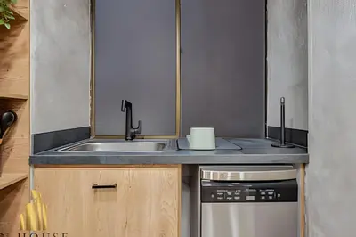 a small kitchen with a sink and a stove at Poblado Del Campestre 203 - Comfort & Exclusivity in Envigado