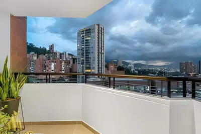 a balcony with a view of a city at Poblado Sandiego 1505 - Cool off in style apt/pool in El Salvador