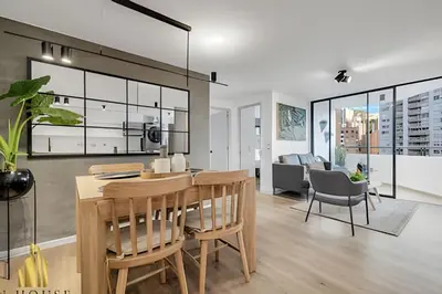 a kitchen and dining room with a table and chairs at Poblado Sandiego 1505 - Cool off in style apt/pool in El Salvador