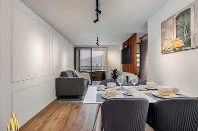 a living room with a dining room table and chairs at Portal de los Parra 1604 - Peaceful apt/Balcony in El Poblado