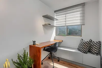 a home office with a desk and a window at Portal de los Parra 1604 - Peaceful apt/Balcony in El Poblado
