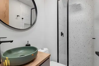 a bathroom with a green sink and a shower at Portal de los Parra 1604 - Peaceful apt/Balcony in El Poblado