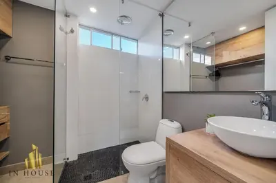 a bathroom with a sink and a toilet and a shower at Provenza Life 1001 - Airy apt w priv balcony & gym in El Poblado