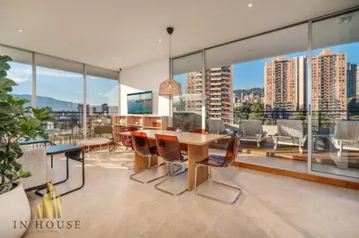 a dining room with a table and chairs and windows at Provenza Life 1001 - Airy apt w priv balcony & gym in El Poblado