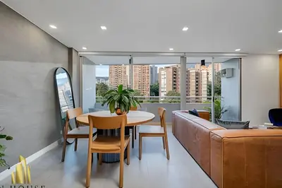 a living room with a table and a couch at Provenza Life 1001 - Airy apt w priv balcony & gym in El Poblado