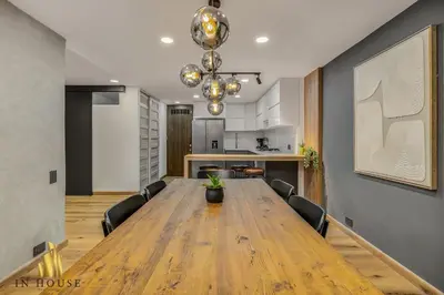 a dining room with a large wooden table and chairs at Provenza Life 1002-Tastefully decorated loft/gym in El Poblado