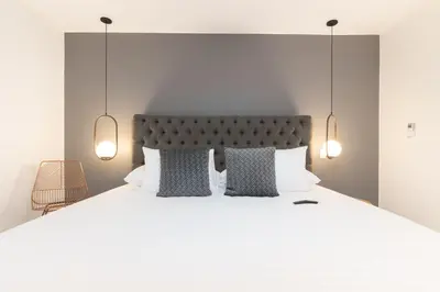 a bedroom with a large white bed with pillows at Provenza Life 1003 - Airy Loft with abundant light in El Poblado