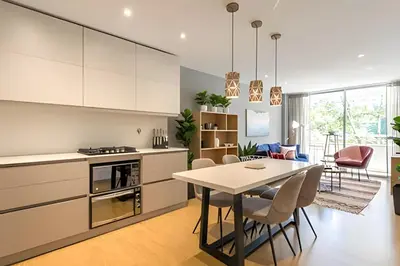 a kitchen and dining room with a table and chairs at Provenza Life 501 - Apt in the heart of Provenza in El Poblado