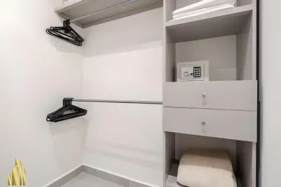 a walk in closet with white walls and shelves at Provenza Life 703 - Secure/bright apt/priv balcony in El Poblado