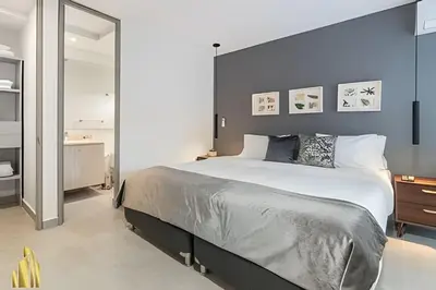 a bedroom with a large bed and a mirror at Provenza Life 703 - Secure/bright apt/priv balcony in El Poblado