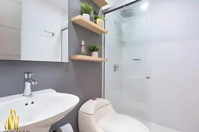 a bathroom with a toilet and a sink and a shower at Provenza Life 901 - Serene/family-friendly loft in El Poblado