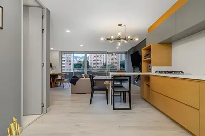 a kitchen and dining room with a table and chairs at Provenza Life 903 - Modern/cozy living in Provenza in El Poblado