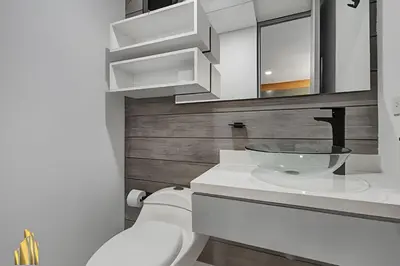 a bathroom with a sink and a toilet at Provenza Life 903 - Modern/cozy living in Provenza in El Poblado