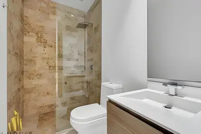 a bathroom with a sink and a toilet and a shower at Q Tower 506 - Bright & Chic Loft In Poblado in Las Palmas