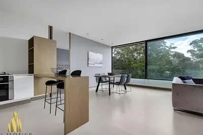 a kitchen and living room with a table and chairs at Q Tower 506 - Bright & Chic Loft In Poblado in Las Palmas