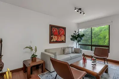 a living room with a couch and a table at San Angel 205-Familiar & Trendy apt near Provenza in El Poblado