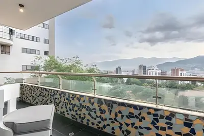 a balcony with a view of the city at Santiago De Bagatela 1104 - Spacious apt Poblado in Envigado