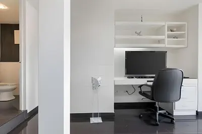 a room with a desk with a computer and a chair at Santiago De Bagatela 1104 - Spacious apt Poblado in Envigado