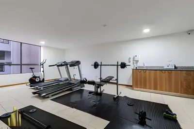 a gym with treadmills and machines in a room at Santiago De Bagatela 401 - Serene apt/sauna & gym in Envigado