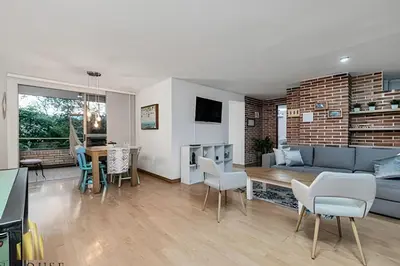 a living room with a couch and a table at Santiago De Bagatela 401 - Serene apt/sauna & gym in Envigado