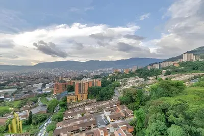 an aerial view of a city with buildings and trees at Scala 1901 - Serene apt/balcony/deluxe furniture in Sabaneta