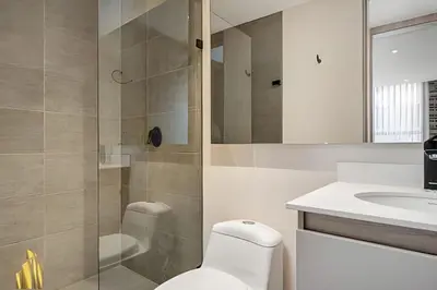 a bathroom with a shower and a toilet and a sink at Solei Loft 201 - Luxe Stay in El Poblado in El Poblado